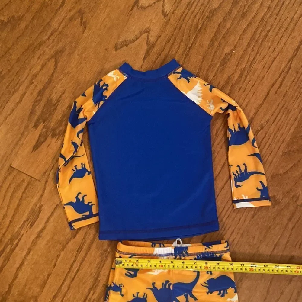 NWT Sinoly size 90–100 cm, 3T  or 4T swim outfit, with dinosaurs